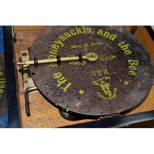 523 - AN EARLY 20TH CENTURY POLYPHON, fitted with six bells, complete with twelve 8  discs