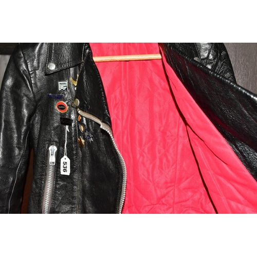 536 - A BLACK LEATHER PIN BADGE BIKER'S JACKET, size small, Frank N Furter style, with sixteen metal pin b... 