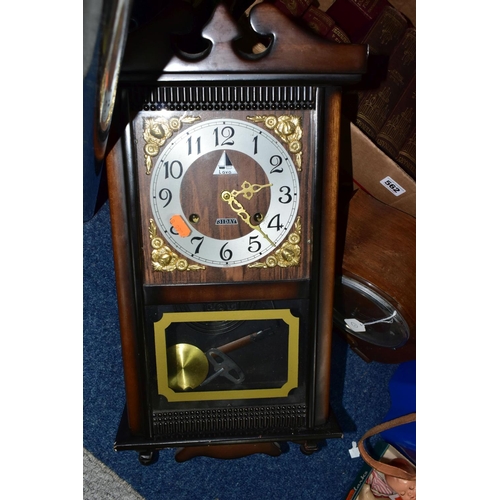 562 - A BOX AND LOOSE BOOKS AND CLOCKS, comprising a Lava 31 day wall clock, a twentieth century wooden ca... 