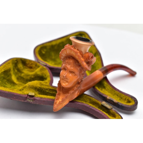 104 - A MEERSCHAUM PIPE, a carved pipe depicting a late 19th century lady in a hat with flowers, approxima... 