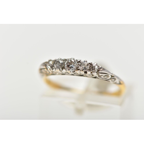 12 - AN 18CT GOLD FIVE STONE DIAMOND RING, set with graduated old cut diamonds and two single cut diamond... 