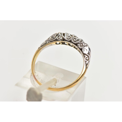 12 - AN 18CT GOLD FIVE STONE DIAMOND RING, set with graduated old cut diamonds and two single cut diamond... 