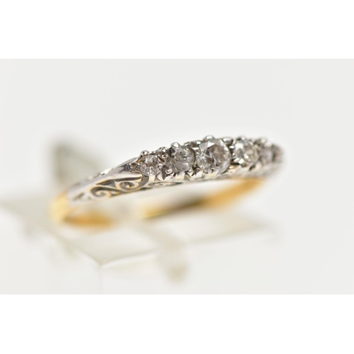 12 - AN 18CT GOLD FIVE STONE DIAMOND RING, set with graduated old cut diamonds and two single cut diamond... 