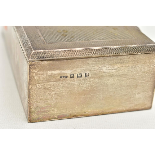 130 - A SILVER CIGARETTE BOX, of a rectangular form, engine turned pattern with an engraved cartouche to t... 