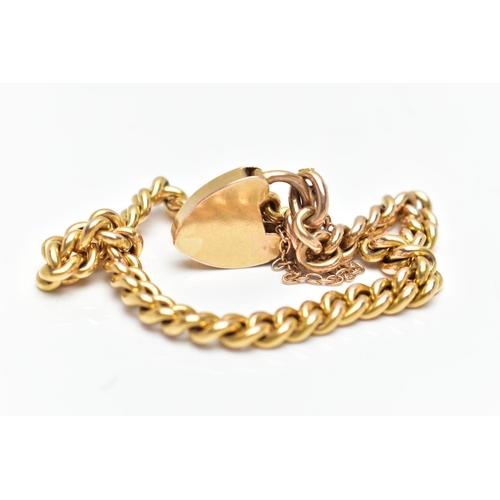 163 - A YELLOW METAL CURB LINK BRACELET, hollow curb links, '15' stamped tag to one link, fitted with a he... 