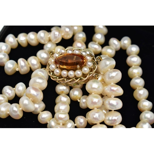 178 - A CULTURED BAROQUE PEARL CHOKER NECKLACE, designed with two rows of baroque cultured pearls, measuri... 