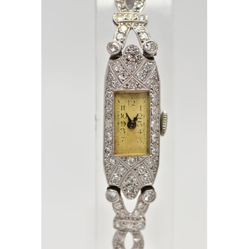 179 - A LADIES 1920S PLATINUM AND DIAMOND COCKTAIL WATCH, manual wind, rectangular dial, worn Arabic numer... 