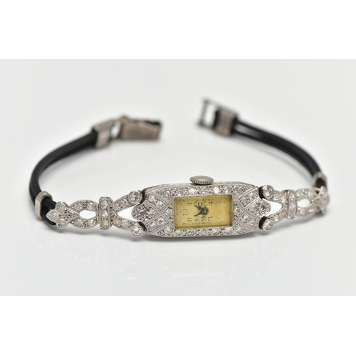 179 - A LADIES 1920S PLATINUM AND DIAMOND COCKTAIL WATCH, manual wind, rectangular dial, worn Arabic numer... 