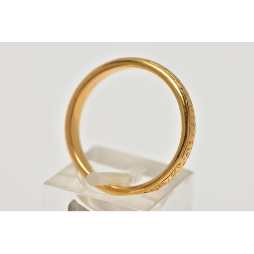 18 - A YELLOW METAL BAND RING, with scroll engraved detail, width of band approximately 4mm, stamped 22ct... 