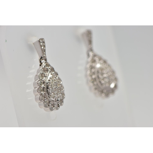 181 - A PAIR OF 9CT WHITE GOLD DIAMOND DROP EARRINGS, each earring of a pear drop shape set with a cluster... 