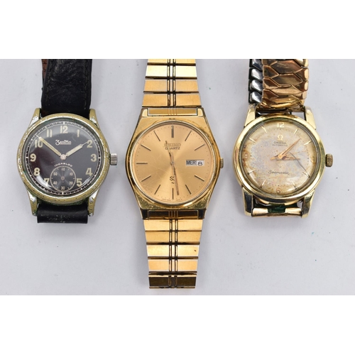 182 - THREE GENTS WRISTWATCHES, to include a gold plated 'Omega, automatic', round discoloured champagne d... 