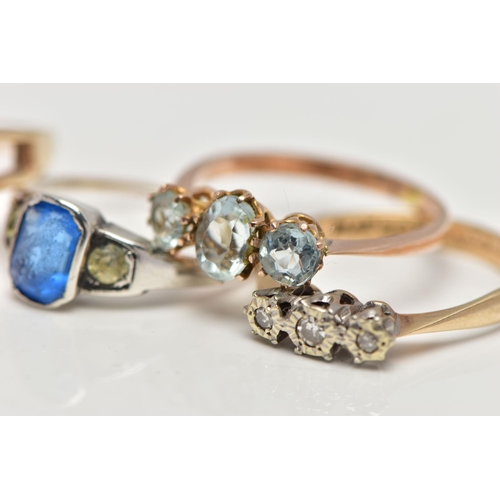 19 - A SELECTION OF FOUR GEM SET RINGS, to include an early 20th century blue and colourless paste three ... 