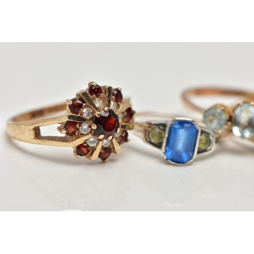 19 - A SELECTION OF FOUR GEM SET RINGS, to include an early 20th century blue and colourless paste three ... 