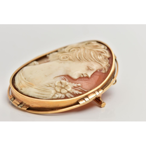 35 - A FRENCH 18CT GOLD CAMEO BROOCH, of an oval form, carved shell cameo depicting a lady in profile, co... 