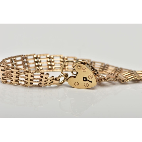 39 - A 9CT GOLD GATE BRACELET, designed with a series of five bar links, some textured some plain polishe... 