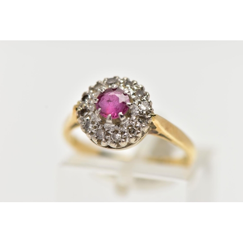 4 - AN 18CT GOLD RUBY AND DIAMOND CLUSTER RING, centering on a circular cut ruby, in an eight claw setti... 