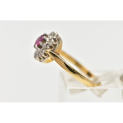 4 - AN 18CT GOLD RUBY AND DIAMOND CLUSTER RING, centering on a circular cut ruby, in an eight claw setti... 