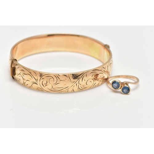 43 - A 9CT GOLD SAPPHIRE RING AND A GOLD PLATED HINGED BANGLE, the ring of a cross over design, set with ... 