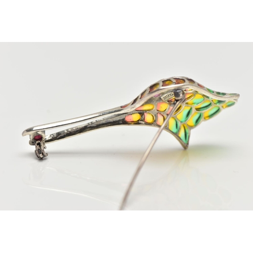 45 - A WHITE METAL PLIQUE A JOUR BROOCH, in the form of a bird head with long beak, to the beak sits a ci... 