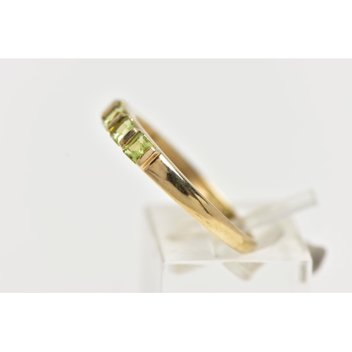 47 - A 9CT GOLD PERIDOT RING, designed with a row of five bar set, square cut peridots, to a polished ban... 