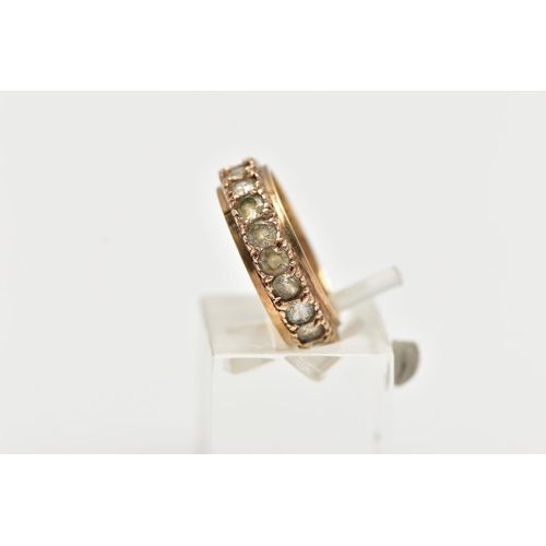 5 - A YELLOW METAL FULL ETERNITY RING, set with a row of circular cut colourless stones assessed as spin... 