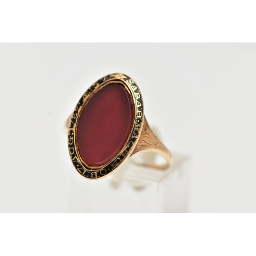 53 - A YELLOW METAL AND CARNELIAN MOURNING RING, of an oval form, set with a central oval cut polished ca... 