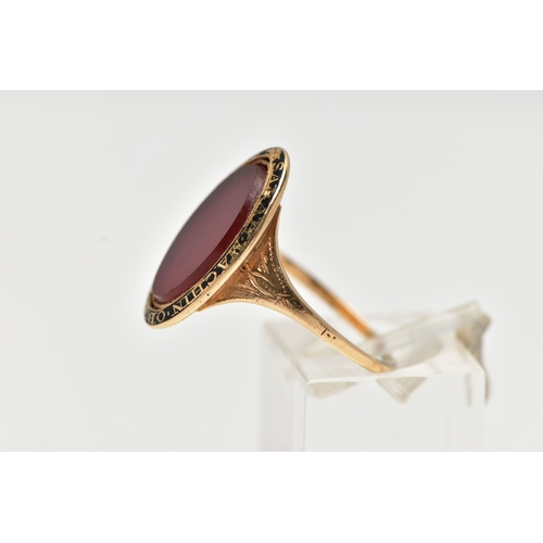 53 - A YELLOW METAL AND CARNELIAN MOURNING RING, of an oval form, set with a central oval cut polished ca... 