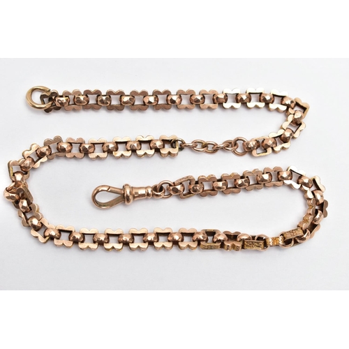 54 - A YELLOW METAL ALBERT CHAIN, designed with a series of wavy square links decorated with worn possibl... 