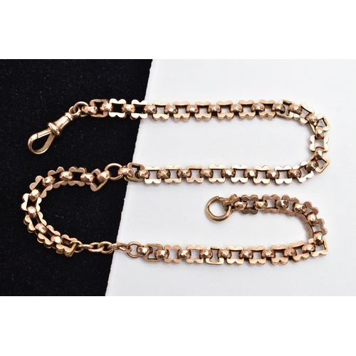 54 - A YELLOW METAL ALBERT CHAIN, designed with a series of wavy square links decorated with worn possibl... 