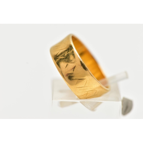 6 - A 22CT YELLOW GOLD WIDE BAND RING, worn textured design all round, approximate band width 6.5mm, hal... 