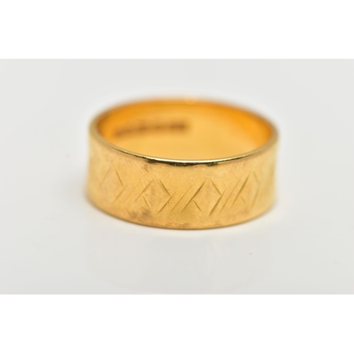 6 - A 22CT YELLOW GOLD WIDE BAND RING, worn textured design all round, approximate band width 6.5mm, hal... 