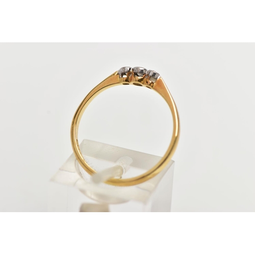 60 - AN 18CT GOLD THREE STONE DIAMOND RING, to the centre is a collet set old cut diamond, flanked with t... 