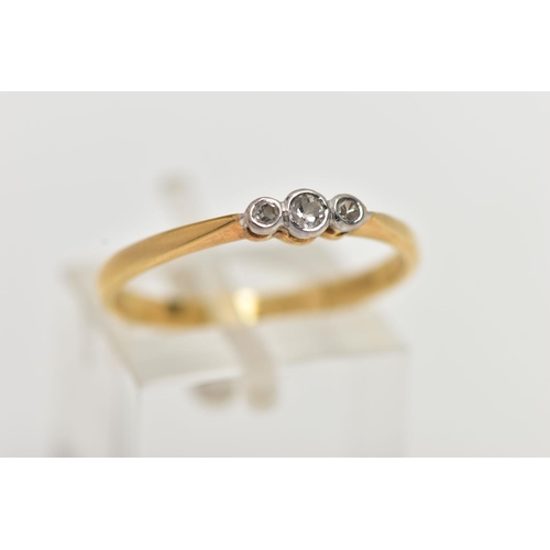 60 - AN 18CT GOLD THREE STONE DIAMOND RING, to the centre is a collet set old cut diamond, flanked with t... 