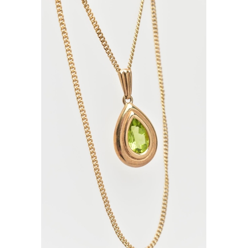 65 - A 9CT GOLD PERIDOT PENDANT NECKLACE, the pendant of a pear drop shape, collet and claw set pear cut ... 