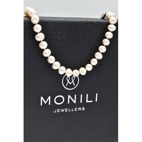 76 - A CULTURED PEARL NECKLACE, a single strand of baroque cultured white pearls with a pink hue, forty t... 