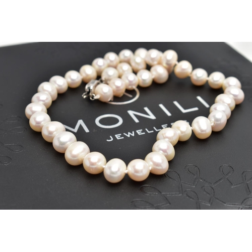 76 - A CULTURED PEARL NECKLACE, a single strand of baroque cultured white pearls with a pink hue, forty t... 