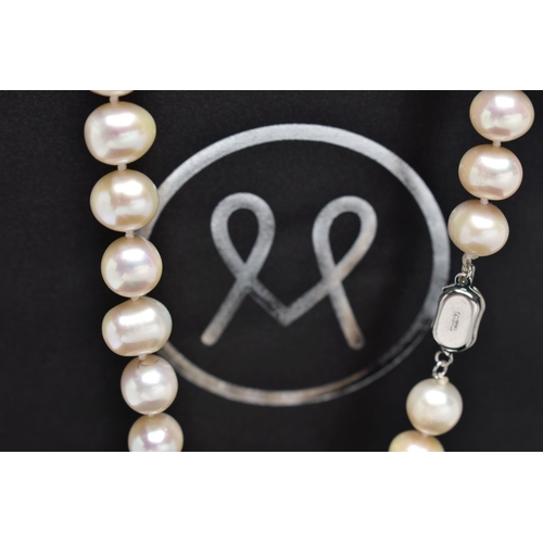 76 - A CULTURED PEARL NECKLACE, a single strand of baroque cultured white pearls with a pink hue, forty t... 