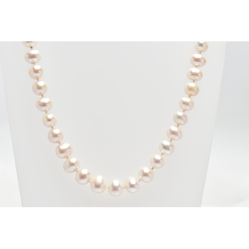 76 - A CULTURED PEARL NECKLACE, a single strand of baroque cultured white pearls with a pink hue, forty t... 