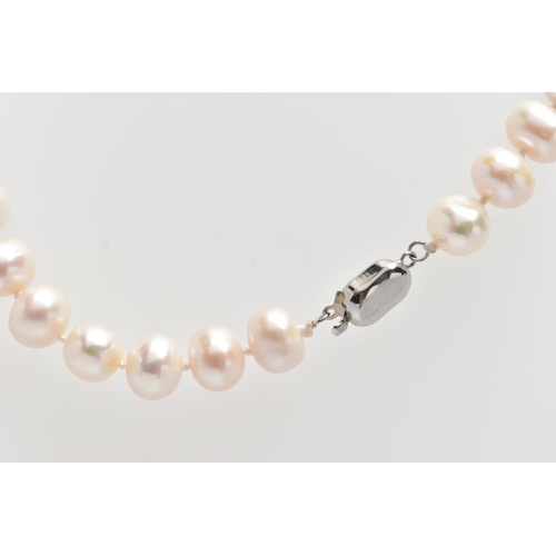 76 - A CULTURED PEARL NECKLACE, a single strand of baroque cultured white pearls with a pink hue, forty t... 