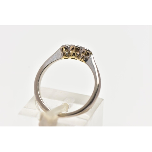 79 - A WHITE METAL THREE STONE DIAMOND RING, to the centre sits a round brilliant cut diamond in an illus... 