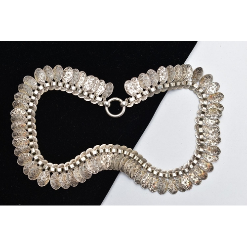 82 - A VICTORIAN WHITE METAL FRINGE CHAIN, designed as a series of floral detailed oval links, fitted wit... 