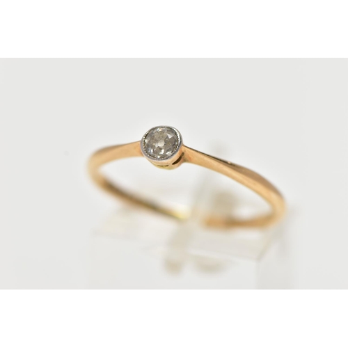 86 - A YELLOW METAL SINGLE STONE DIAMOND RING, set with an old cut diamond in a milgrain setting, estimat... 