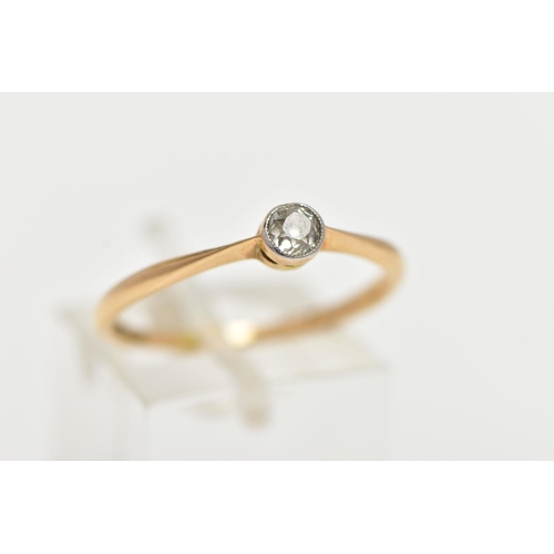 86 - A YELLOW METAL SINGLE STONE DIAMOND RING, set with an old cut diamond in a milgrain setting, estimat... 