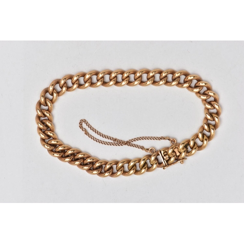 9 - A YELLOW METAL CURB LINK BRACELET, polished yellow metal, fitted with an integrated box clasp with a... 