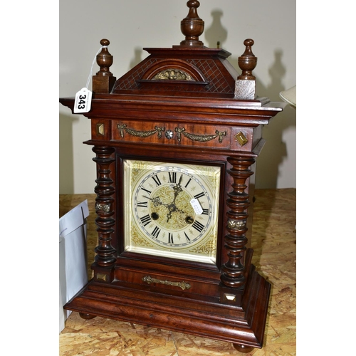 343 - TWO ANTIQUE CLOCKS, comprising a black slate and marble mantel clock, with white enamel dial bearing... 