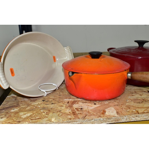 344 - FOUR PIECES OF LE CREUSET CAST IRON ENAMELLED COOK WARES, comprising a dark red casserole dish, diam... 