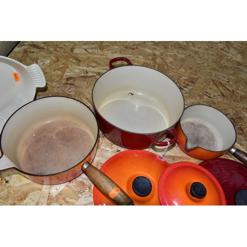 344 - FOUR PIECES OF LE CREUSET CAST IRON ENAMELLED COOK WARES, comprising a dark red casserole dish, diam... 