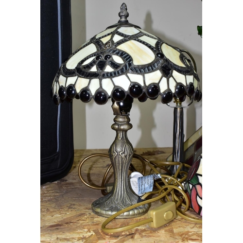 357 - A GROUP OF THREE TIFFANY STYLE TABLE LAMPS, comprising a tall foliate and dragonfly lamp base with s... 