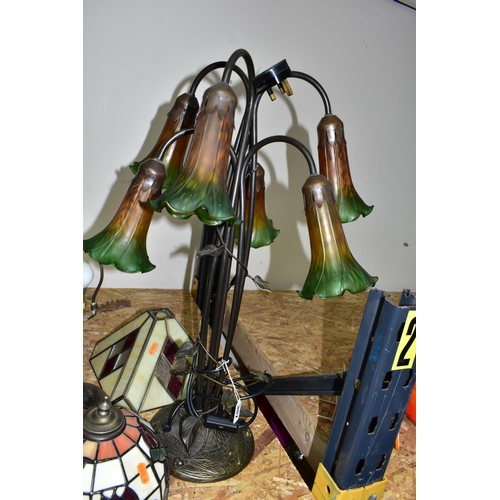 357 - A GROUP OF THREE TIFFANY STYLE TABLE LAMPS, comprising a tall foliate and dragonfly lamp base with s... 