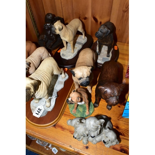 371 - A COLLECTION OF BULL MASTIFF DOG FIGURINES, comprising a bronzed effect figure of a girl reading to ... 